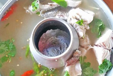 Hot and sour Tom Yum soup with sea bass