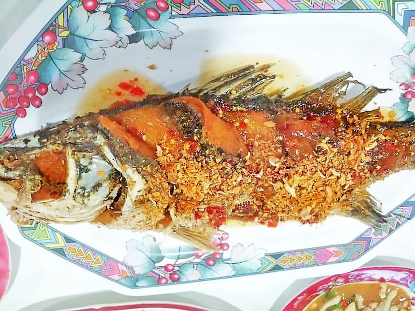 Deep fried sea bass topped with sweet sour and hot sauce