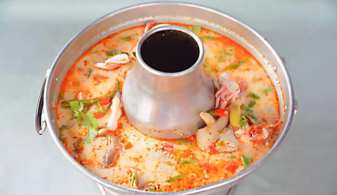 Hot and sour Tom Yum milky soup with seafood