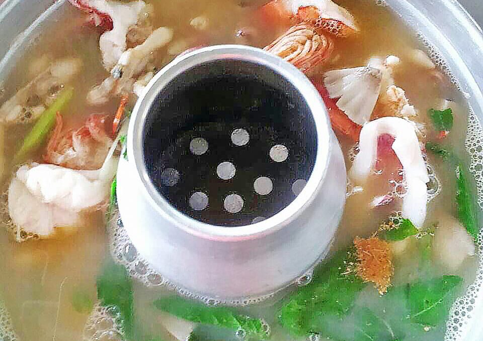 Hot and sour Tom Yum clear soup with seafood